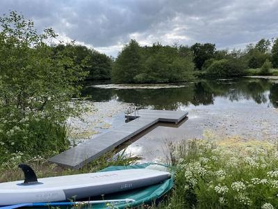 Hammer head jetty clad with composite