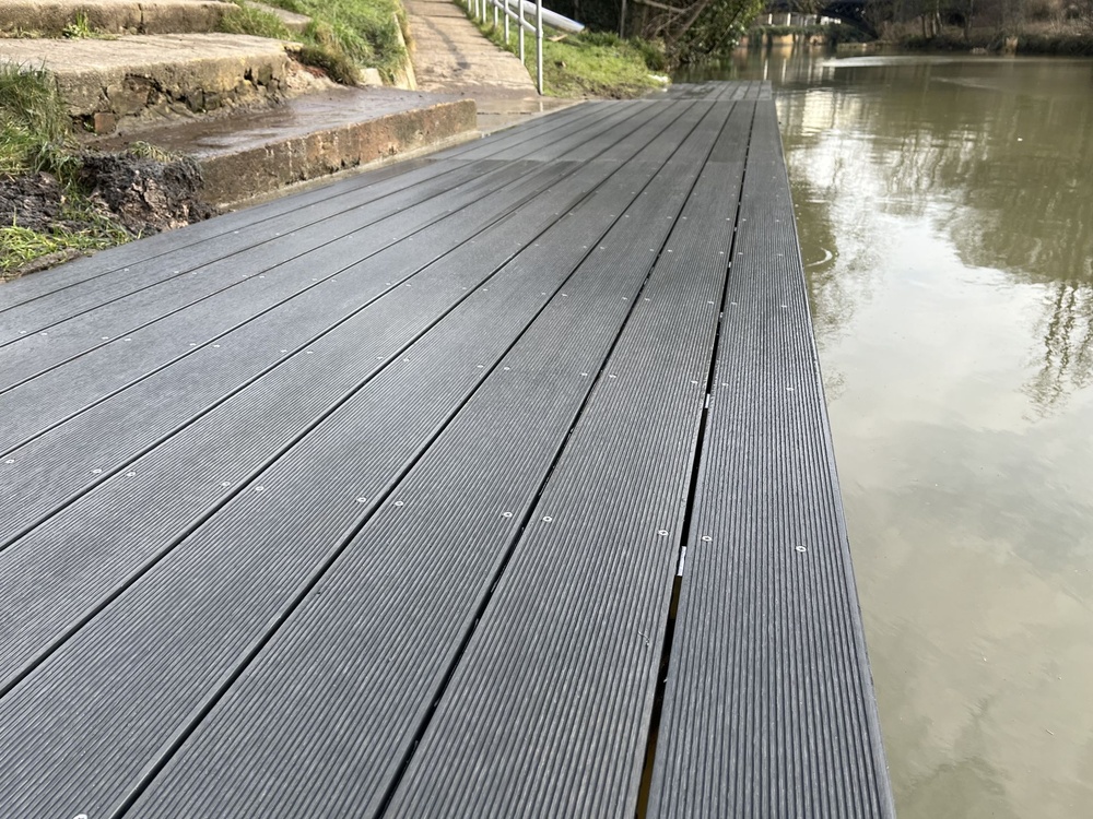 Upgraded landing stage with durable composite decking in stone grey finish.